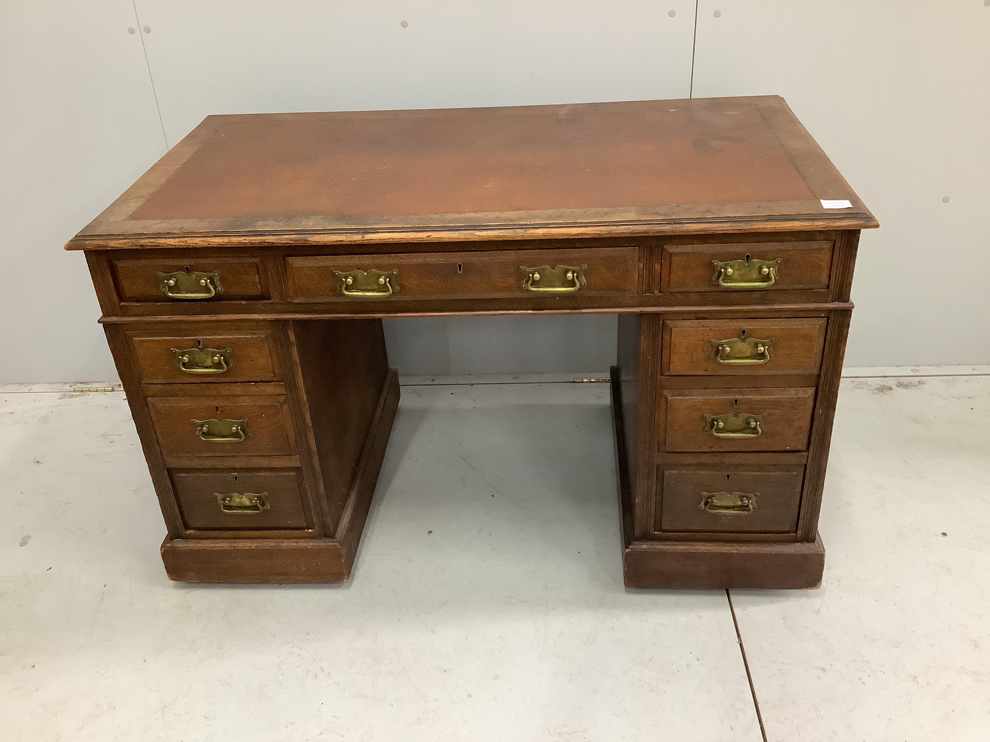 An early 20th century oak pedestal desk, width 121cm, depth 65cm, height 75cm
